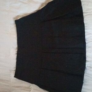 Black pleated mini skirts
